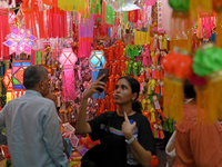 People shop for lanterns at a market ahead of the Hindu festival of Diwali in Mumbai, India, on October 23, 2024. (