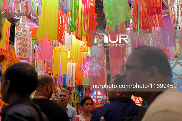 People shop for lanterns at a market ahead of the Hindu festival of Diwali in Mumbai, India, on October 23, 2024. 