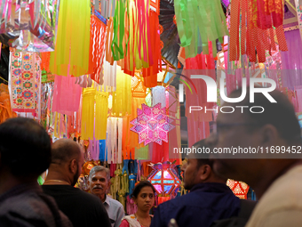 People shop for lanterns at a market ahead of the Hindu festival of Diwali in Mumbai, India, on October 23, 2024. (