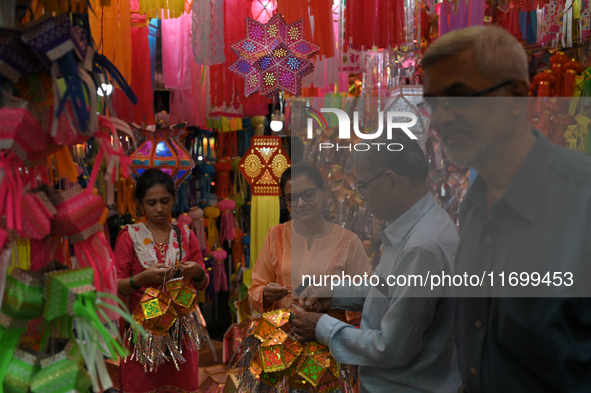 People shop for lanterns at a market ahead of the Hindu festival of Diwali in Mumbai, India, on October 23, 2024. 