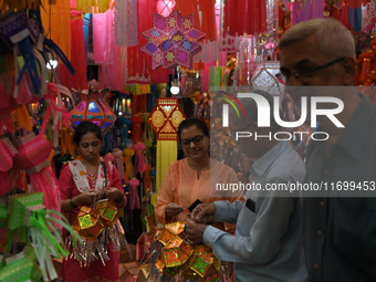 People shop for lanterns at a market ahead of the Hindu festival of Diwali in Mumbai, India, on October 23, 2024. (