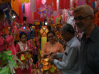 People shop for lanterns at a market ahead of the Hindu festival of Diwali in Mumbai, India, on October 23, 2024. (