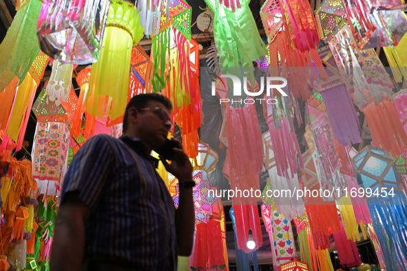 People shop for lanterns at a market ahead of the Hindu festival of Diwali in Mumbai, India, on October 23, 2024. 