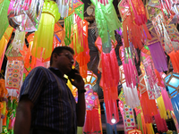 People shop for lanterns at a market ahead of the Hindu festival of Diwali in Mumbai, India, on October 23, 2024. (