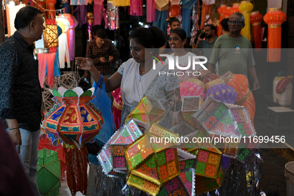 People shop for lanterns at a market ahead of the Hindu festival of Diwali in Mumbai, India, on October 23, 2024. 