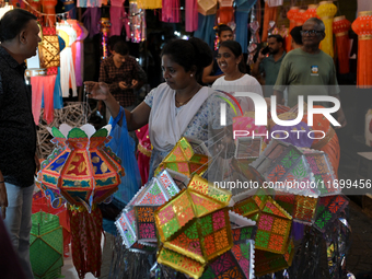 People shop for lanterns at a market ahead of the Hindu festival of Diwali in Mumbai, India, on October 23, 2024. (