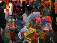 People shop for lanterns at a market ahead of the Hindu festival of Diwali in Mumbai, India, on October 23, 2024. (