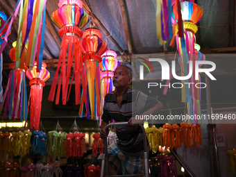 A man arranges a lantern at a market ahead of the Hindu festival of Diwali in Mumbai, India, on October 23, 2024. (