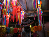 A man arranges a lantern at a market ahead of the Hindu festival of Diwali in Mumbai, India, on October 23, 2024. (