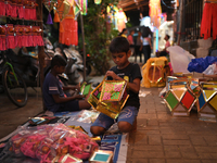 A child makes lanterns at a market ahead of the Hindu festival of Diwali in Mumbai, India, on October 23, 2024. (