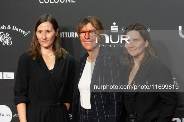 Bettina Boettinger, the TV presenter, Vanessa Bitter, news prize winner, and Sina Tonk, woman category winner, are seen on the red carpet of...