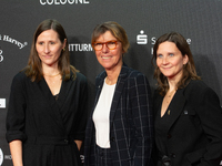 Bettina Boettinger, the TV presenter, Vanessa Bitter, news prize winner, and Sina Tonk, woman category winner, are seen on the red carpet of...