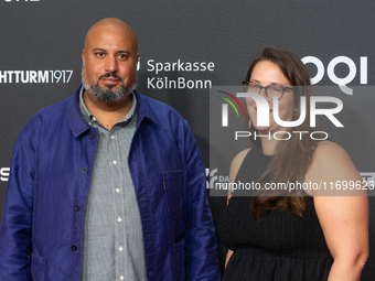 Michael Premo, a filmmaker who receives the Der Phoenix Preis with his companion, is seen on the red carpet of Film Palast in Cologne, Germa...