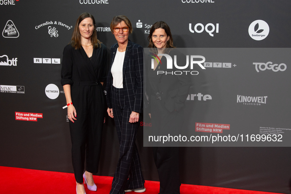 Bettina Boettinger, the TV presenter, Vanessa Bitter, news prize winner, and Sina Tonk, woman category winner, are seen on the red carpet of...