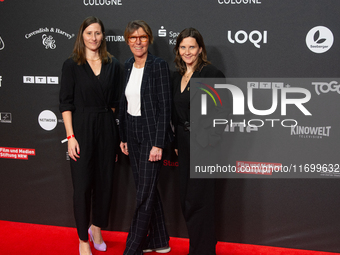 Bettina Boettinger, the TV presenter, Vanessa Bitter, news prize winner, and Sina Tonk, woman category winner, are seen on the red carpet of...