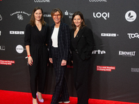 Bettina Boettinger, the TV presenter, Vanessa Bitter, news prize winner, and Sina Tonk, woman category winner, are seen on the red carpet of...