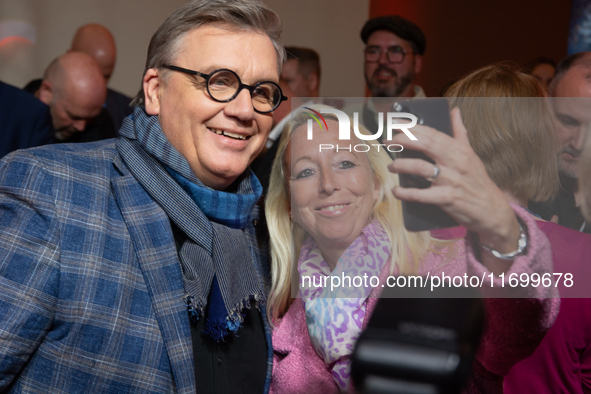 Hape Kerkeling, a German actor and writer, is greeted by his fans on the red carpet of the photocall for ''Total Normal - Hape Kerkeling'' a...