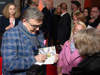 Hape Kerkeling, a German actor and writer, is greeted by his fans on the red carpet of the photocall for ''Total Normal - Hape Kerkeling'' a...