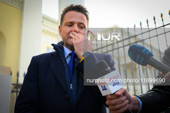 Mayor Rafal Trzaskowski is seen approaching protesters outside city hall during a rally against conditions in cat shelters in Warsaw, Poland...