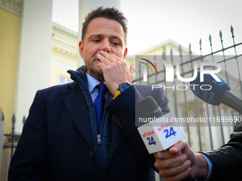 Mayor Rafal Trzaskowski is seen approaching protesters outside city hall during a rally against conditions in cat shelters in Warsaw, Poland...