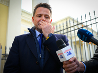 Mayor Rafal Trzaskowski is seen approaching protesters outside city hall during a rally against conditions in cat shelters in Warsaw, Poland...