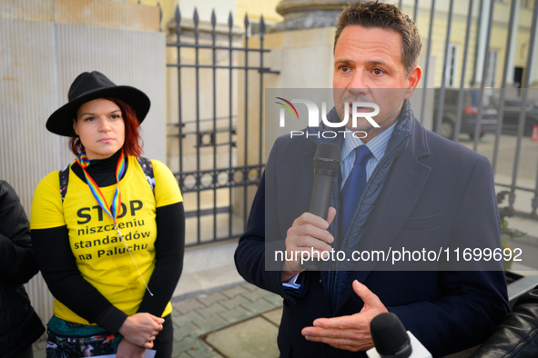 Mayor Rafal Trzaskowski speaks to protesters outside city hall during a rally against conditions in cat shelters in Warsaw, Poland on 23 Oct...