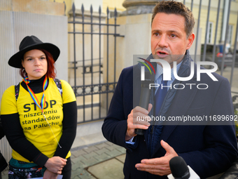 Mayor Rafal Trzaskowski speaks to protesters outside city hall during a rally against conditions in cat shelters in Warsaw, Poland on 23 Oct...