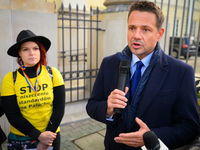 Mayor Rafal Trzaskowski speaks to protesters outside city hall during a rally against conditions in cat shelters in Warsaw, Poland on 23 Oct...