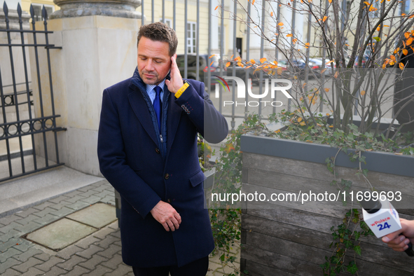 Mayor Rafal Trzaskowski is seen approaching protesters outside city hall during a rally against conditions in cat shelters in Warsaw, Poland...