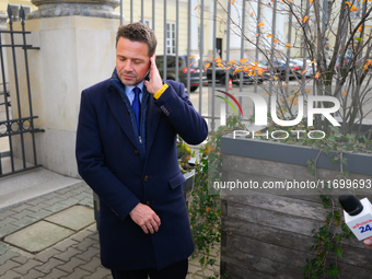 Mayor Rafal Trzaskowski is seen approaching protesters outside city hall during a rally against conditions in cat shelters in Warsaw, Poland...