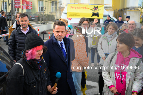 Mayor Rafal Trzaskowski is seen approaching protesters outside city hall during a rally against conditions in cat shelters in Warsaw, Poland...