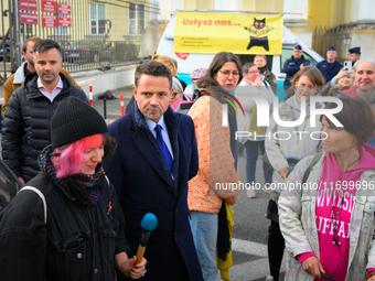 Mayor Rafal Trzaskowski is seen approaching protesters outside city hall during a rally against conditions in cat shelters in Warsaw, Poland...