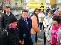 Mayor Rafal Trzaskowski is seen approaching protesters outside city hall during a rally against conditions in cat shelters in Warsaw, Poland...