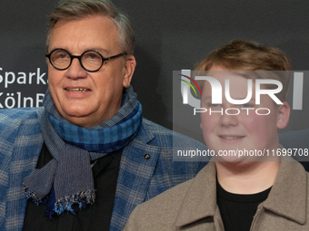 Hape Kerkeling, a German actor, and Julius Weckauf, a German actor, are seen on the red carpet of the photocall for ''Total Normal - Hape Ke...