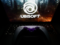 Ubisoft logo displayed on a laptop screen and DualSense controller are seen in this illustration photo taken in Krakow, Poland on October 23...