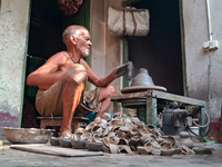 An elderly potter makes earthen diyas ahead of the Diwali Festival in Siliguri, India, on October 24, 2024. (