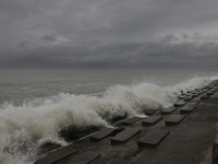 Waves overflow onto a damaged sea front before Cyclone Dana in Digha, West Bengal, on October 24, 2024. Cyclonic storm Dana currently barrel...