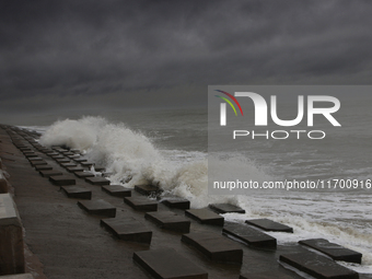 Waves overflow onto a damaged sea front before Cyclone Dana in Digha, West Bengal, on October 24, 2024. Cyclonic storm Dana currently barrel...