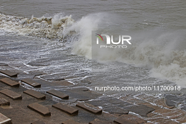 Waves overflow onto a damaged sea front before Cyclone Dana in Digha, West Bengal, on October 24, 2024. Cyclonic storm Dana currently barrel...