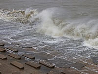 Waves overflow onto a damaged sea front before Cyclone Dana in Digha, West Bengal, on October 24, 2024. Cyclonic storm Dana currently barrel...