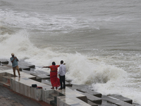 Waves overflow onto a damaged sea front before Cyclone Dana in Digha, West Bengal, on October 24, 2024. Cyclonic storm Dana currently barrel...