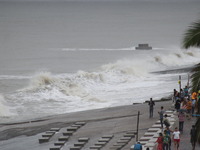 Waves overflow onto a damaged sea front before Cyclone Dana in Digha, West Bengal, on October 24, 2024. Cyclonic storm Dana currently barrel...