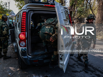 Security officials stand outside the court after a cop is injured when a grenade accidentally explodes in the Baramulla Court Complex in Jam...