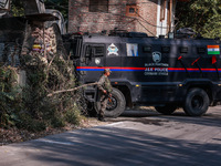 Security officials stand outside the court after a cop is injured when a grenade accidentally explodes in the Baramulla Court Complex in Jam...