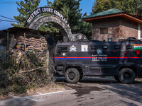 Security officials stand outside the court after a cop is injured when a grenade accidentally explodes in the Baramulla Court Complex in Jam...