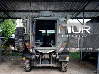 A large tank is parked within the intelligence compound before the operation begins. Special Forces, the Black Army, and Volunteer Force Ope...