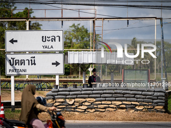 An armed soldier works at a checkpoint in Pattani. Special Forces, the Black Army, and Volunteer Force Operations in Thailand's Deep South p...