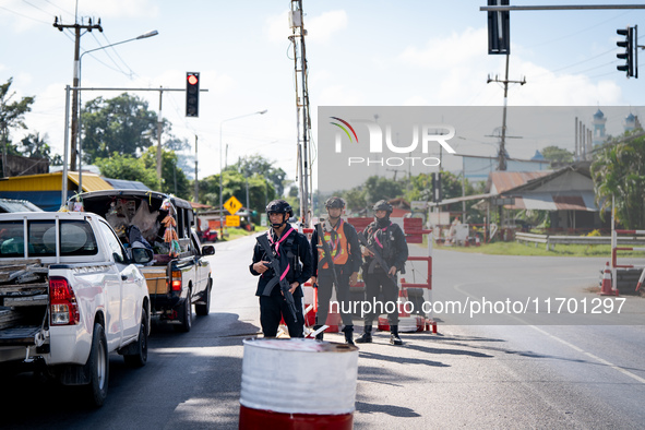 Soldiers work at a checkpoint in Pattani. Special Forces, the Black Army, and Volunteer Force Operations in Thailand's Deep South perform in...