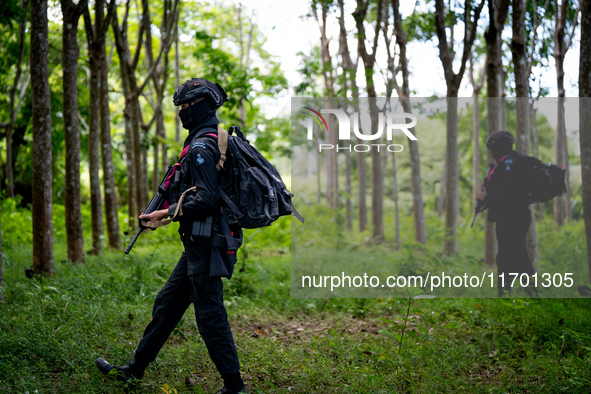 Snipers patrol the jungle in Pattani. Special Forces, the Black Army, and Volunteer Force Operations in Thailand's Deep South perform intell...