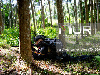 Snipers patrol the jungle in Pattani. Special Forces, the Black Army, and Volunteer Force Operations in Thailand's Deep South perform intell...